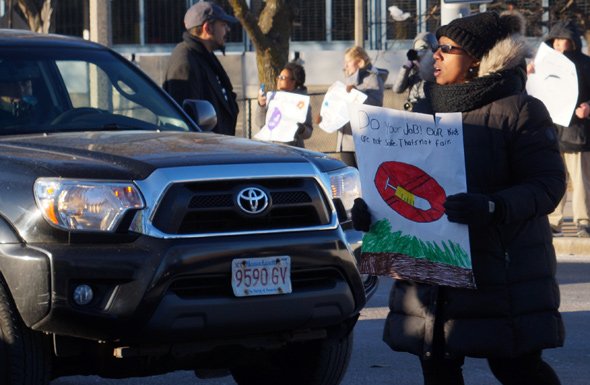 Parent protesting needles at Orchard Gardens School