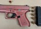 Pink gun, bullets and magazine