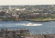 Boat doing donuts in inner Boston Harbor