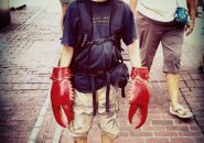 Kid with lobster claws in downtown Boston