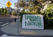 Mattress painted to read: Nothing Really Mattress