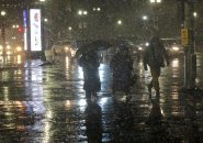 Pedestrians in the snow near North Station