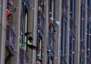 Construction workers watch Patriots go by