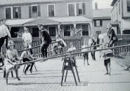 Kids on seesaws in old Boston