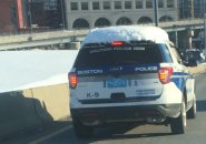 Snow-covered Boston Police cruiser on the Southeast Expressway