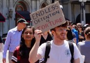 Wayfair worker holding sign reading Endless Detention is Torture