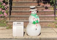 Snowman figure and an air conditioner