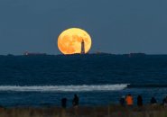 Harvest moon rises over the Five Sisters off Winthrop