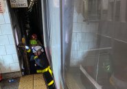 Firefighters at Andrew Red Line stop