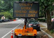 Sign board reading: Utility work ahead how bout dat