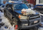 Car with trash on it in South Boston