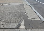 Filled in sidewalk crack that looks like New Hampshire