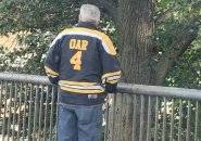 Man wearing 'Oar' Bruins jersey