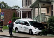 Cab got the worst of it in crash with house on Walworth Street