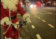 Biking Santa on Centre Street in West Roxbury