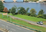 Guy driving down the bike/pedestrian path along the Charles River