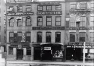 Street scene in old Boston, featuring store selling rubbers