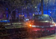 Car on Green Line tracks along Beacon Street