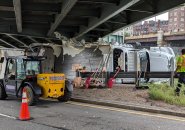 Crew tries to remove storrowed truck at Bowker Overpass