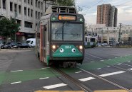 Trolley with googly eyes makes the turn at Packards Corner