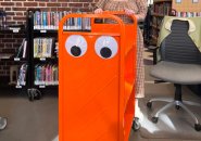 Googly-eyed book cart at Jamaica Plain library