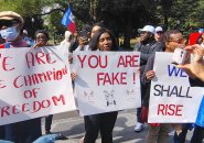 Haitians on the Common with signs supporting the community