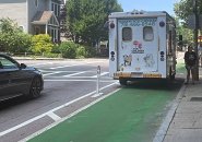 Ice-cream truck parked in a bike lane