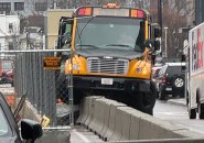 Bus wound up atop Jersey barriers at Guest and Arthur streets