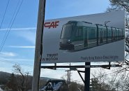 Sign advertising an Elmira Heights factory that will soon be making Green Line trolleys