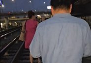 Passengers walking on Orange Line tracks