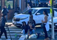 Bystanders attend to downed bicyclist before police, paramedics arrive