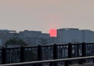 Hazy red sunrise over Boston