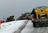 Line of salt trucks waiting to pick up salt at Public Works shed in West Roxbury