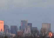 Two downtown building fiercely reflecting the setting sun around 4:05 p.m.