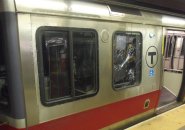 Red Line car with smashe- in window