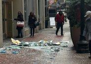 Smashed window bits lying on Washington Street