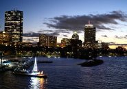 Sunset over the Charles River Lagoon and the Community Boating Christmas boat