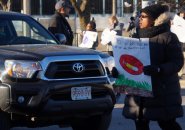 Parent protesting needles at Orchard Gardens School