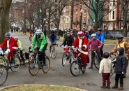 Santa on a bicycle on Commonwealth Avenue in the Back Bay