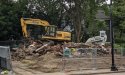 What's left of 19th century house on Centre Street, with backhoe on top