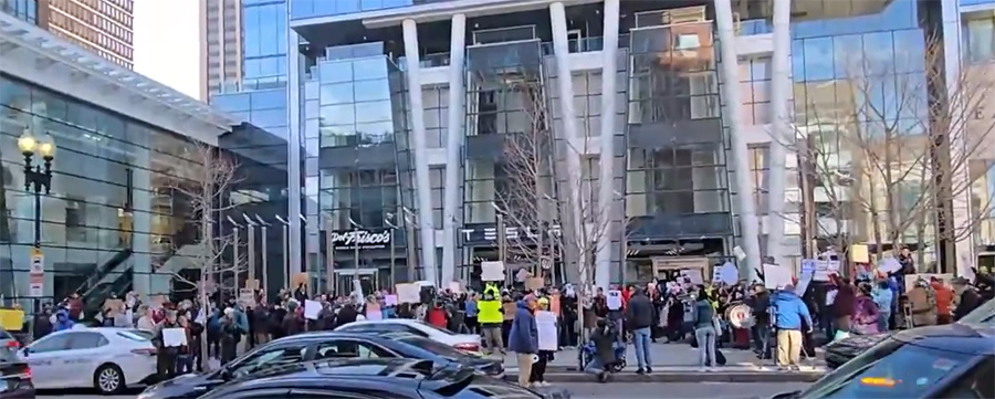 People protesting Musk outside the Prudential Center Tesla showroom