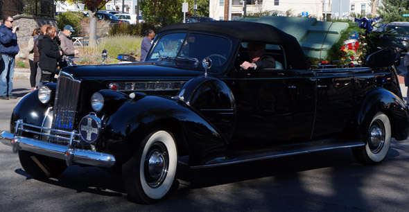 Funeral procession in Roslindale: Flowers in a Packard