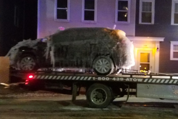 Frozen car towed from Charlestown fire scene