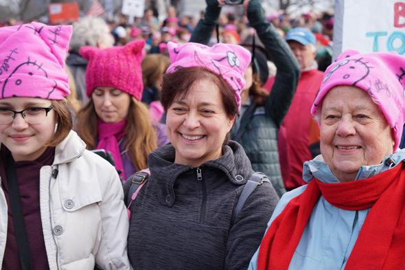 Three women with pussy hats