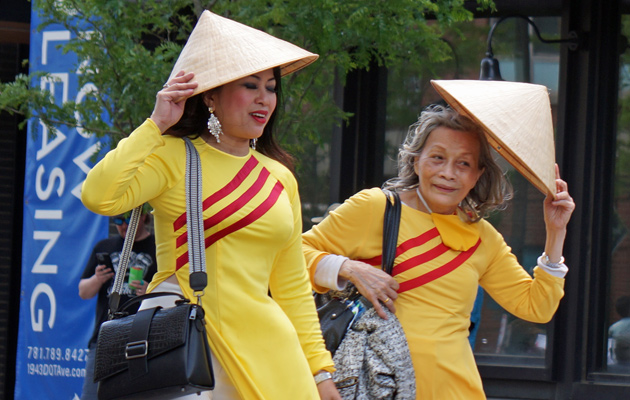 Women in Vietnamese dresses and hats