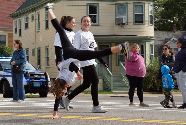 Dancer does one-armed handstand