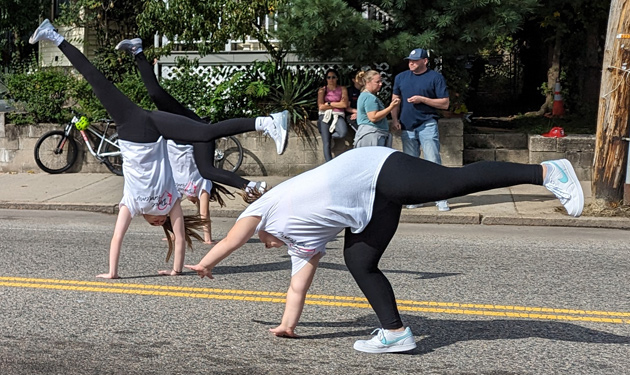 Dancers somersaulting