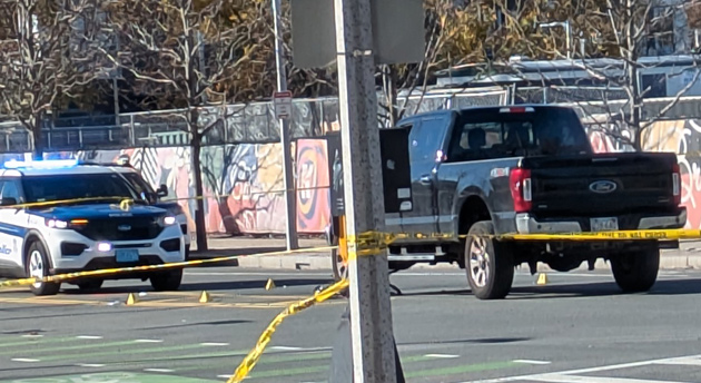 Pickup, police tape and evidence cones