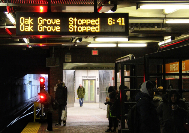 Forest Hills signboard reading 'Stopped' for both upcoming trains, which weren't coming