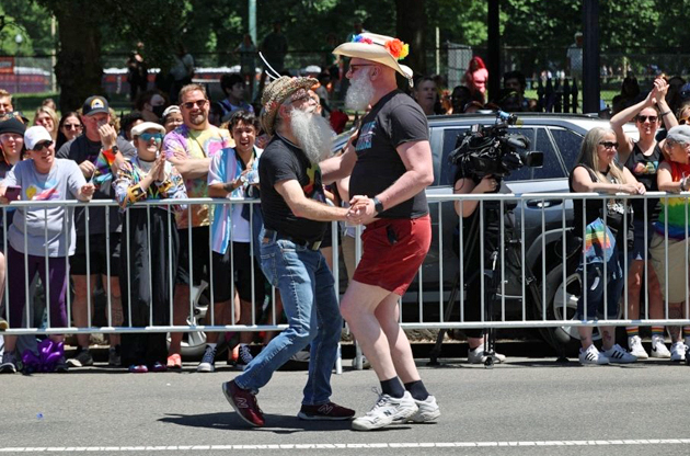 Men dancing in the Pride parade